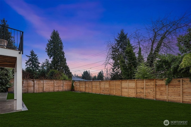 view of yard with a fenced backyard