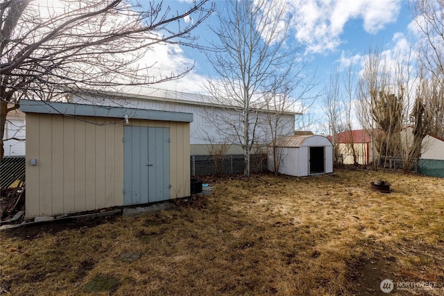 view of shed with fence