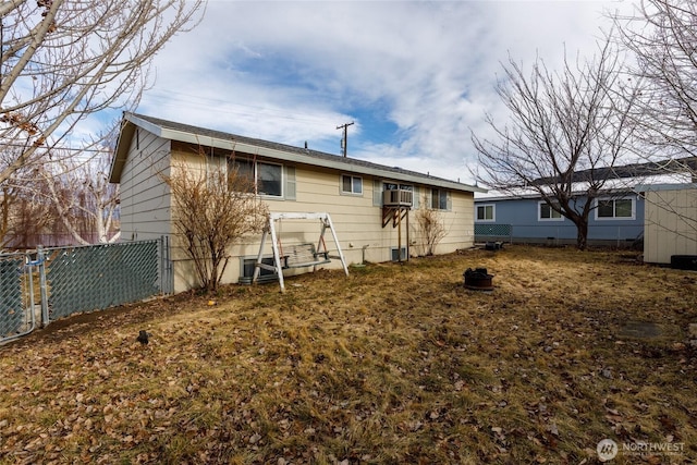 back of house with fence