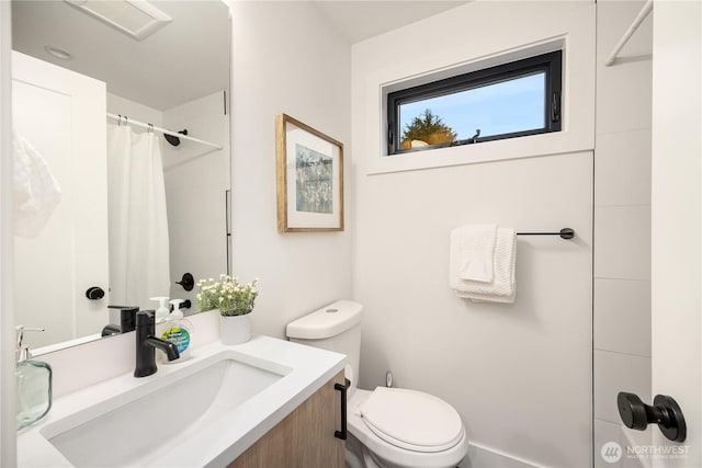 bathroom with vanity, toilet, and a shower with curtain