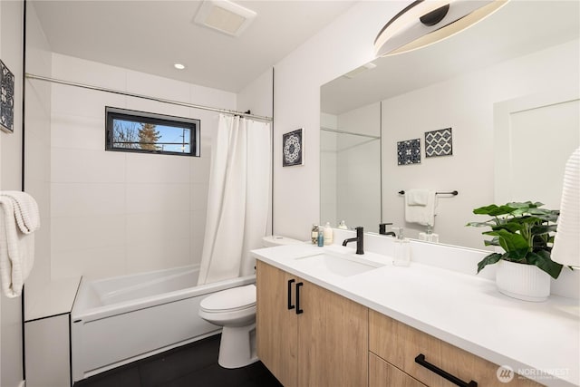 full bathroom with shower / bath combo, visible vents, vanity, and toilet