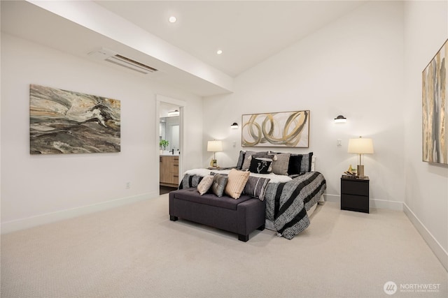 carpeted bedroom with high vaulted ceiling, recessed lighting, connected bathroom, and baseboards