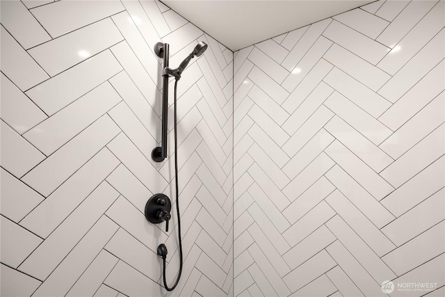 room details with a tile shower