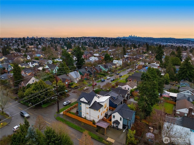 aerial view at dusk with a residential view