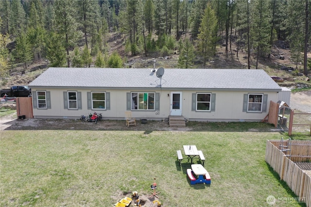 722 Aeneas Valley Rd, Tonasket, WA 98855 - view of front of property with entry steps, a front lawn, roof with shingles, and fence