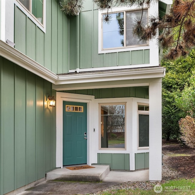 doorway to property featuring board and batten siding