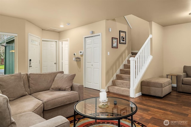 living area with dark wood-style floors, recessed lighting, stairs, and baseboards