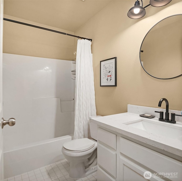 bathroom featuring vanity, toilet, shower / bath combo with shower curtain, and tile patterned flooring