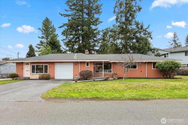 ranch-style house featuring driveway, board and batten siding, a front yard, a garage, and a chimney