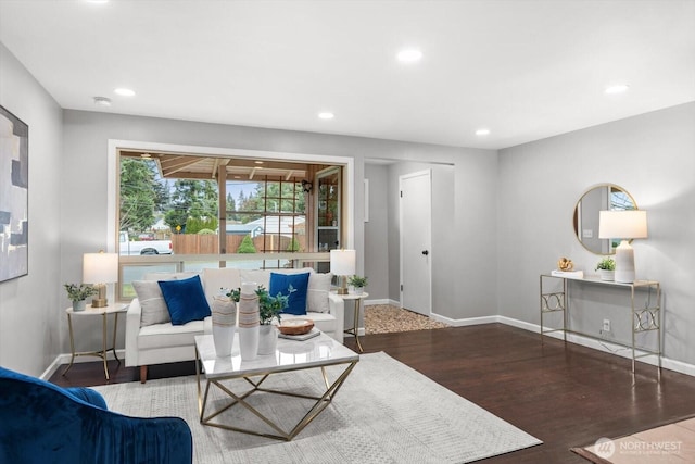 living room featuring recessed lighting, wood finished floors, and baseboards