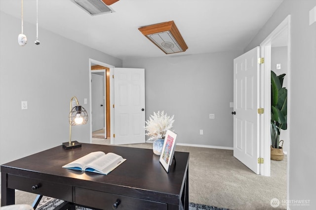 office featuring carpet flooring, baseboards, and visible vents