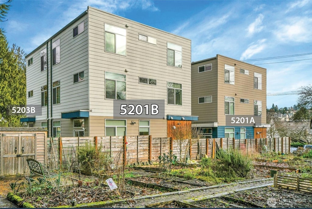 view of property with fence