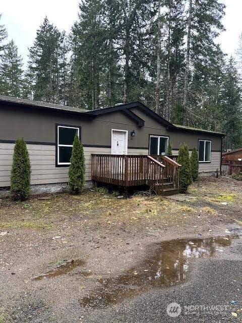 view of front of property with a wooden deck