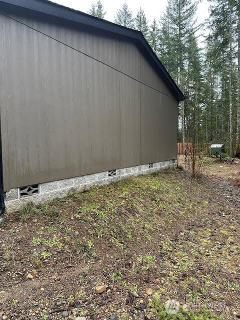 view of home's exterior with crawl space