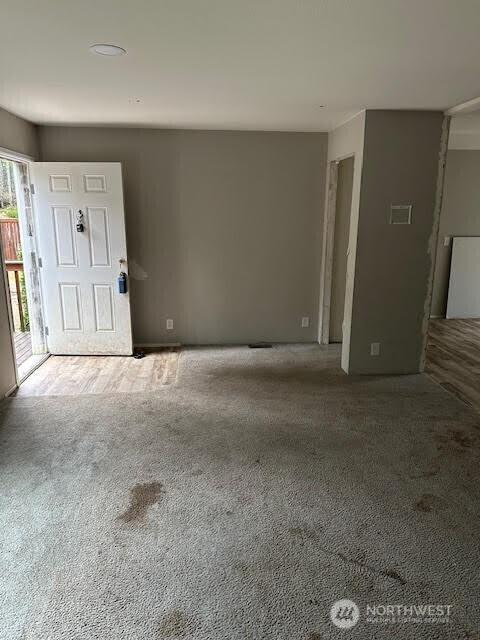 entrance foyer with carpet