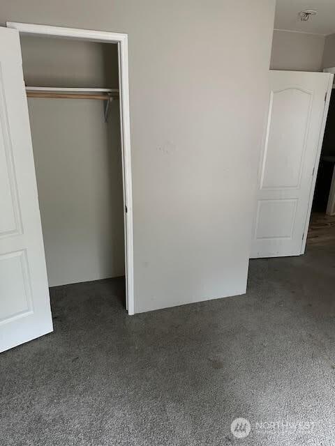 unfurnished bedroom with a closet