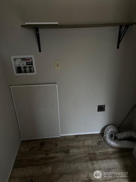 laundry area with hookup for a washing machine, laundry area, and dark wood-type flooring