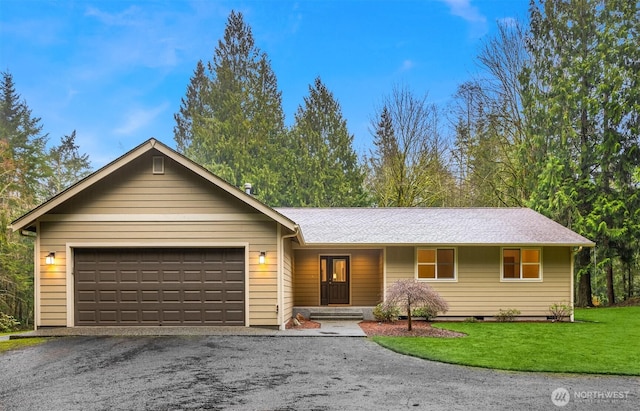 single story home featuring a garage, driveway, and a front yard