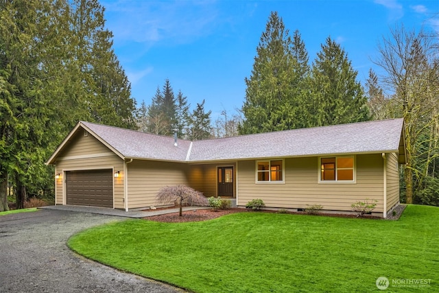 ranch-style house featuring a garage, crawl space, driveway, and a front lawn