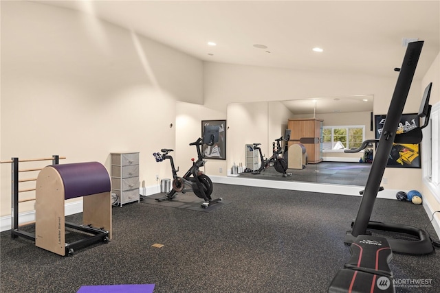 exercise room featuring vaulted ceiling, baseboards, and recessed lighting