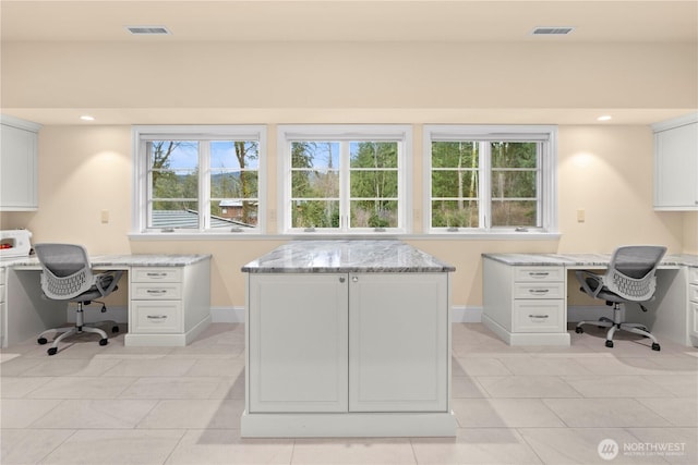 home office with visible vents, baseboards, and light tile patterned floors