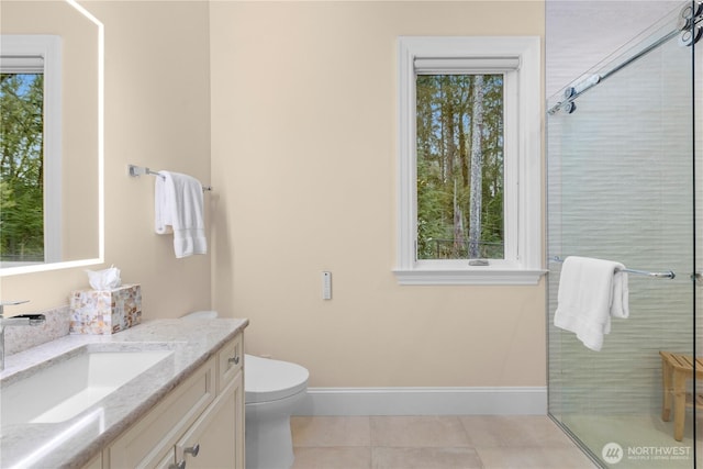 full bathroom featuring a stall shower, tile patterned floors, a wealth of natural light, and vanity