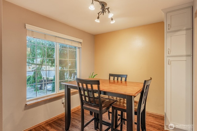 dining space featuring wood finished floors