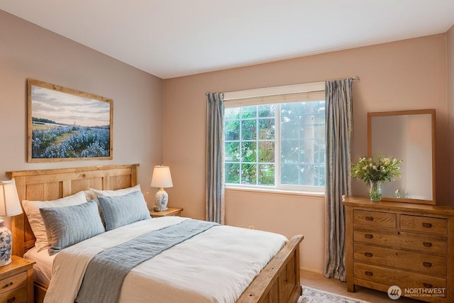 bedroom featuring light carpet