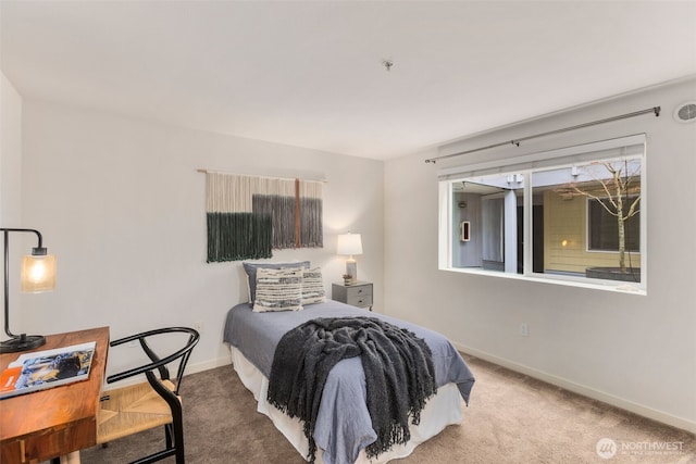 carpeted bedroom with baseboards