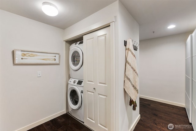 washroom with laundry area, baseboards, stacked washer and clothes dryer, dark wood-type flooring, and recessed lighting