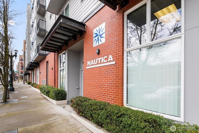 entrance to property with brick siding