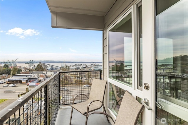 balcony featuring a water view