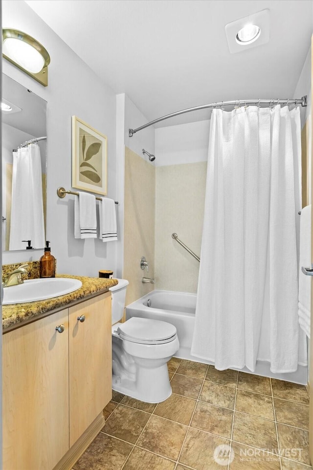 full bath with shower / bath combination with curtain, vanity, toilet, and tile patterned floors