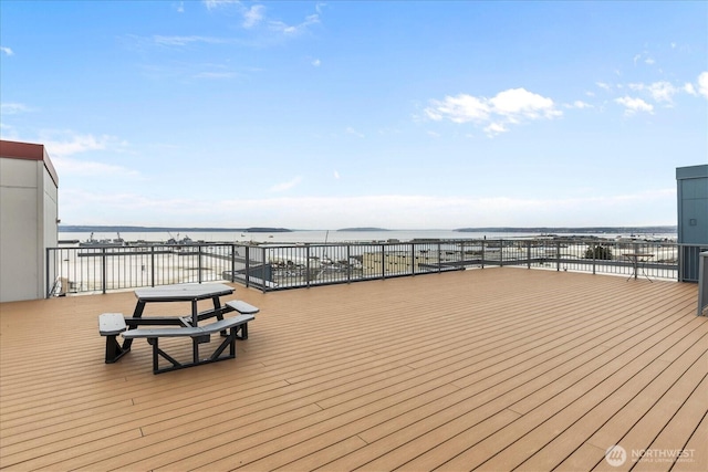 wooden terrace with a water view