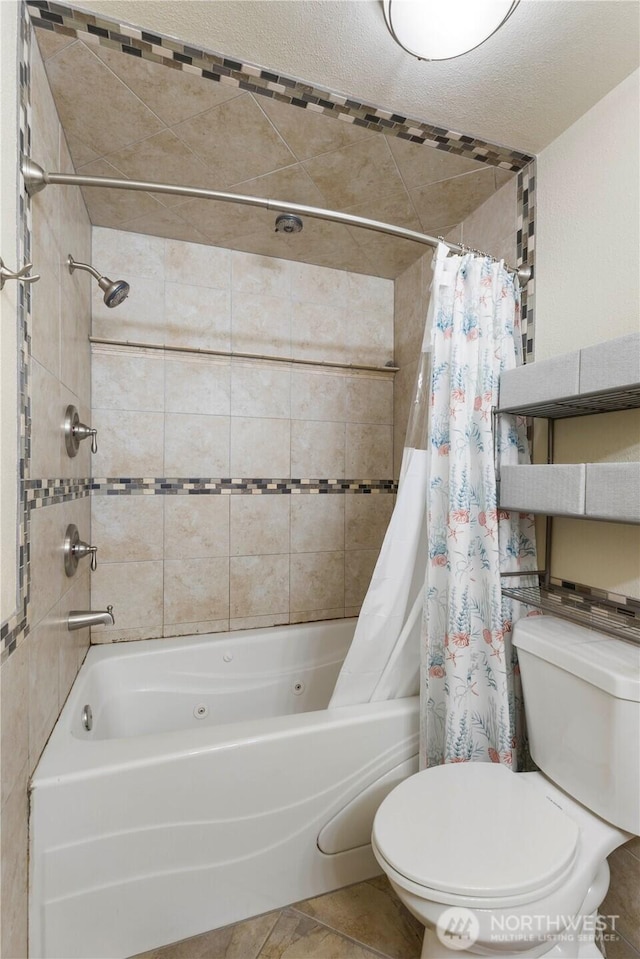 bathroom with shower / tub combo and toilet