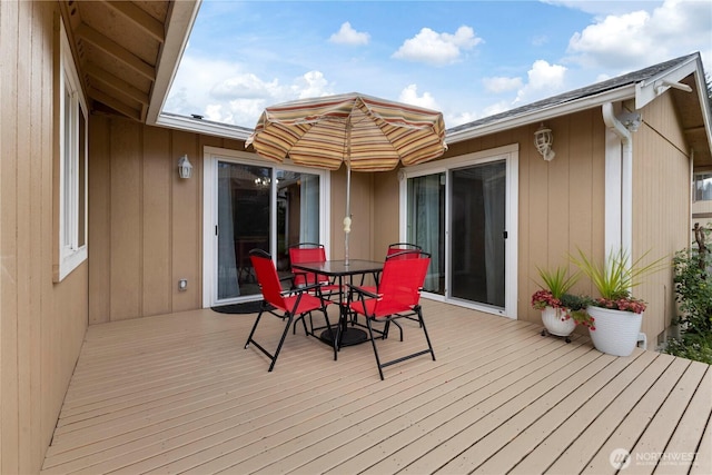 deck with outdoor dining space