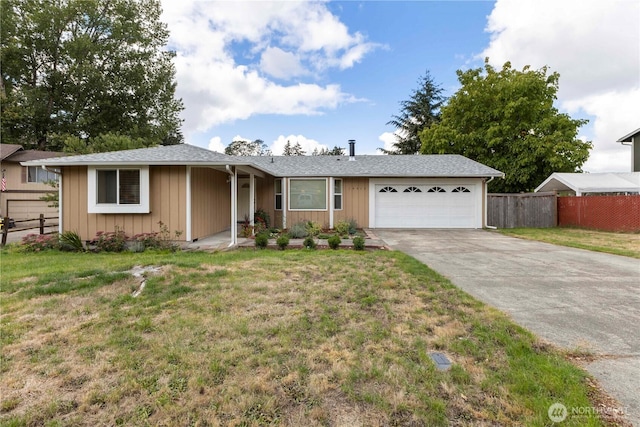 single story home featuring a garage, a front yard, and fence