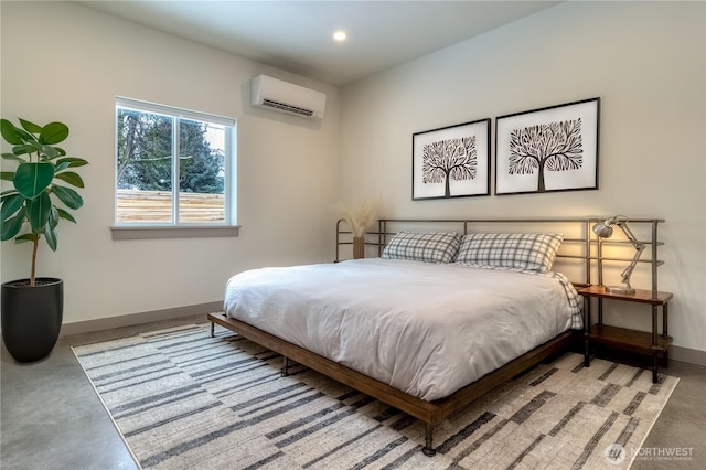 bedroom featuring recessed lighting, concrete floors, a wall mounted air conditioner, and baseboards