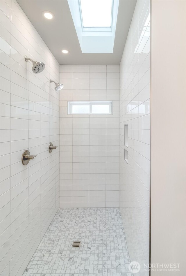 full bathroom with a stall shower and recessed lighting