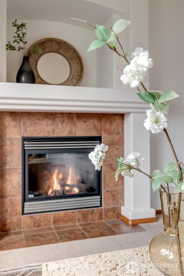 room details featuring a tiled fireplace