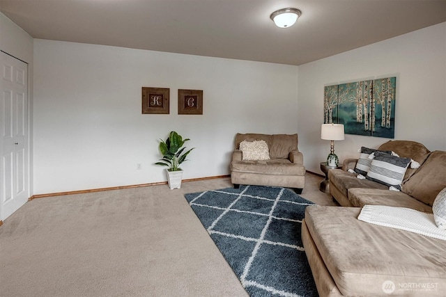 living room featuring carpet and baseboards