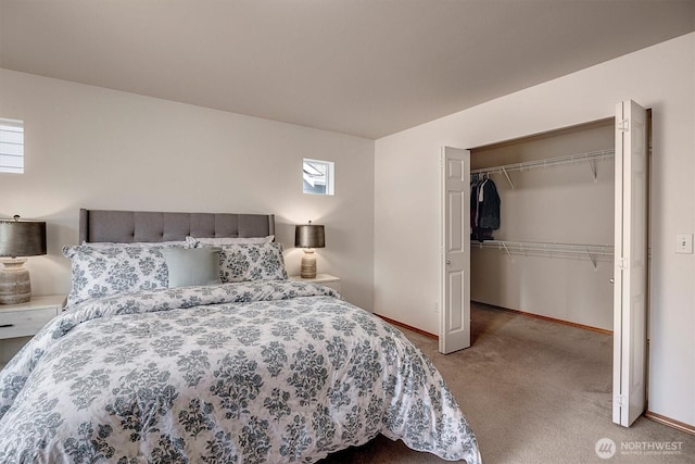 bedroom with a closet, carpet flooring, and baseboards