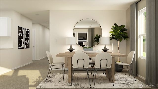 dining space with light carpet and baseboards