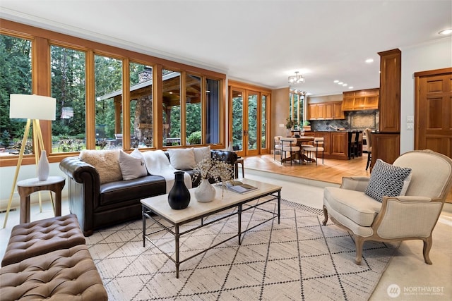 living area featuring recessed lighting and crown molding