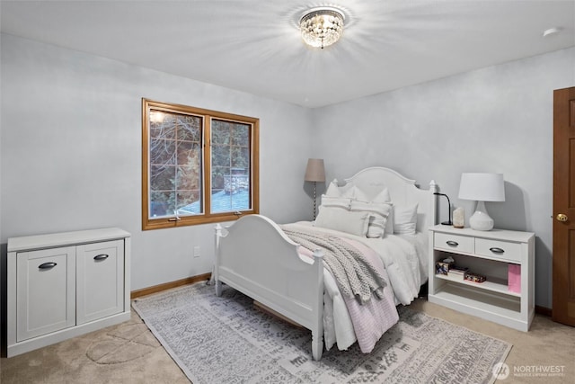 bedroom featuring light carpet and baseboards