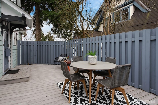 deck featuring outdoor dining area