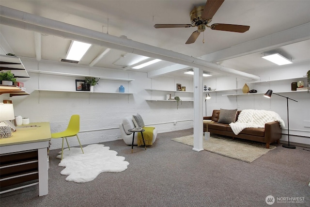 finished basement featuring carpet and ceiling fan