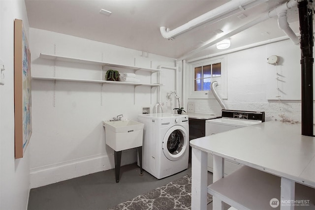 clothes washing area with laundry area and washer and dryer