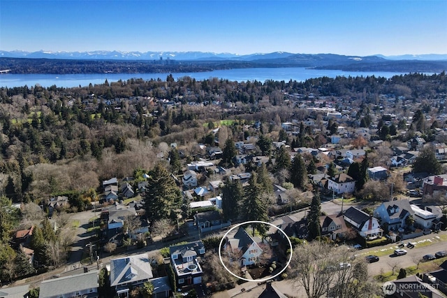 aerial view featuring a residential view and a water and mountain view