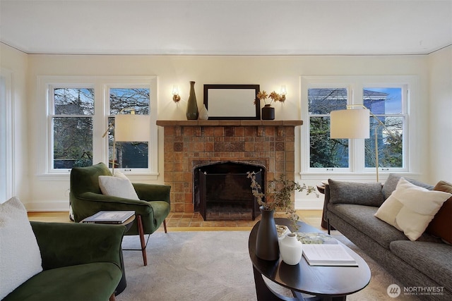 living room featuring a brick fireplace